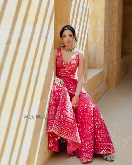 Pretty bright pink sharara look with mirrorwork detailing 